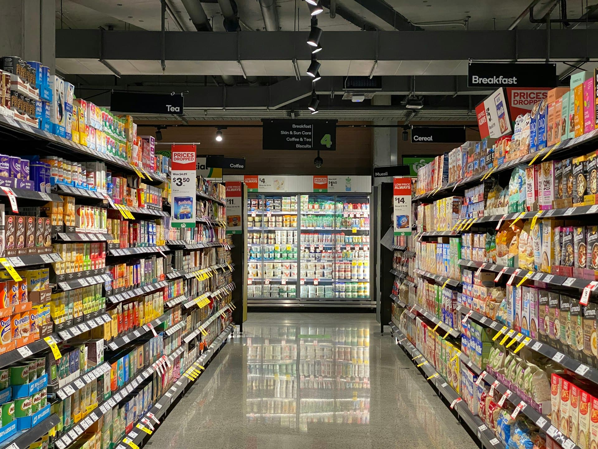 Grocery store aisle with fully stocked shelves