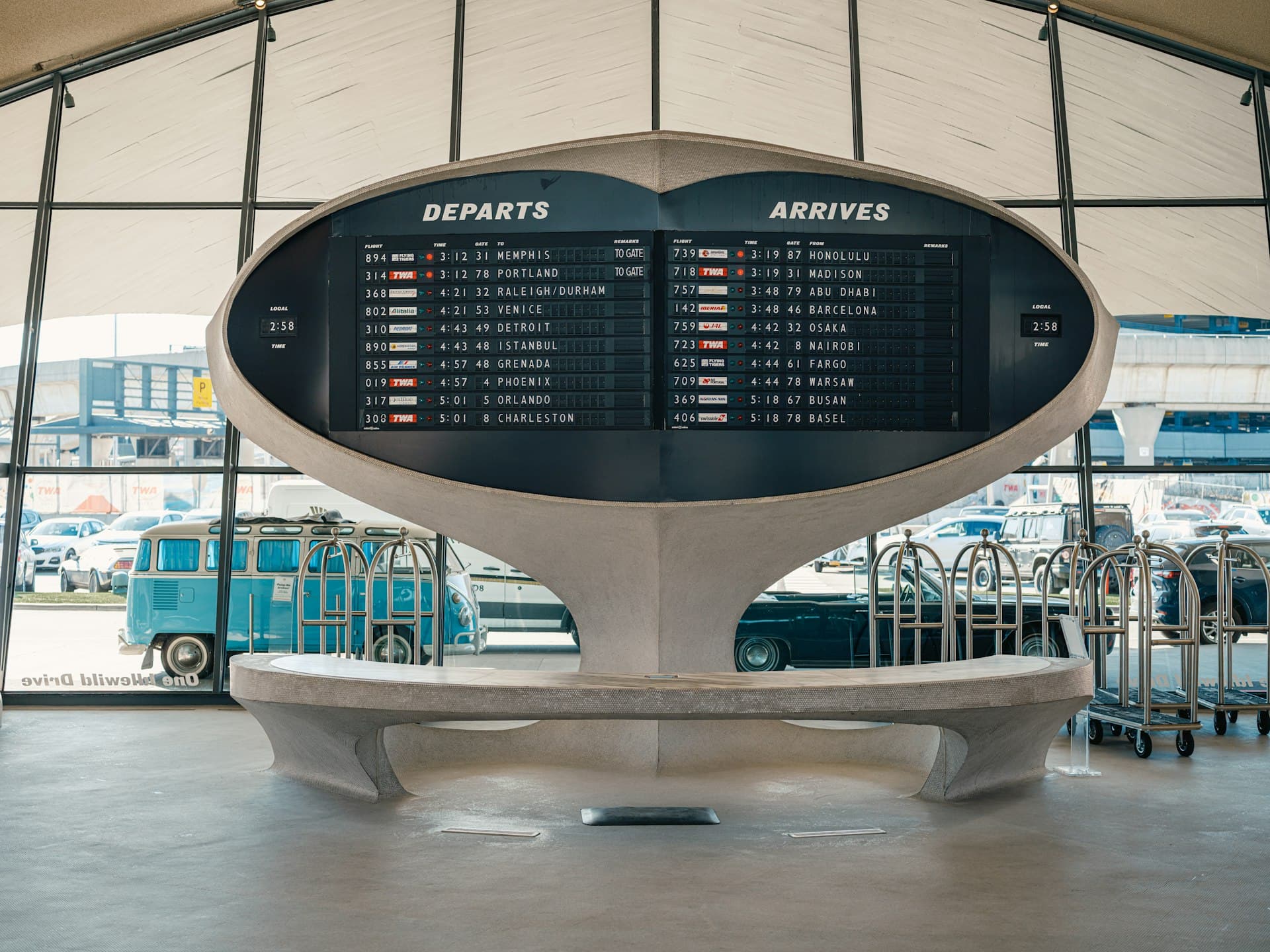 Airport flight information display board listing departures
