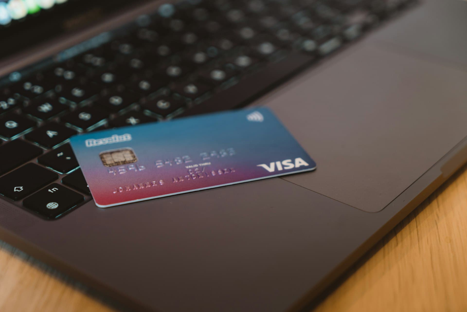 Credit card resting on a laptop keyboard