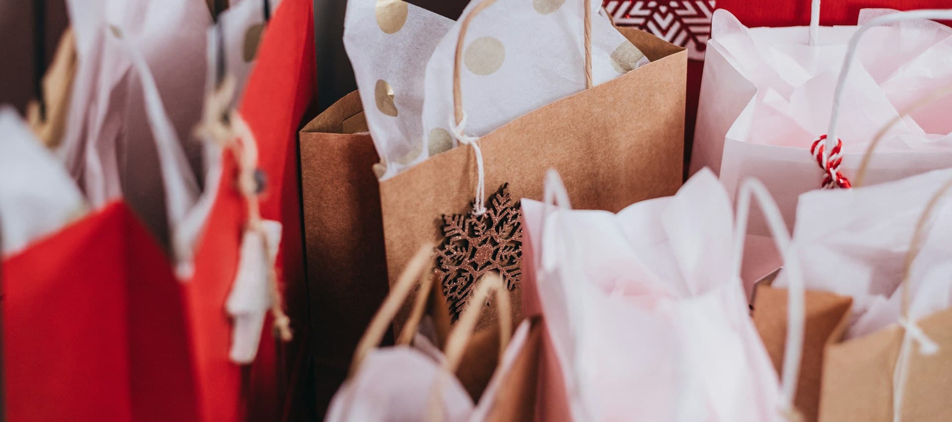 Paper shopping bags with tissue paper, close up